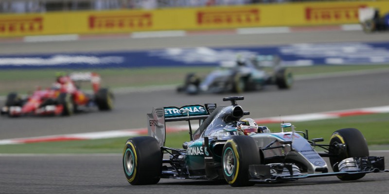 Mercedes driver Lewis Hamilton of Britain steers his car in front of Ferrari driver Kimi Raikkonen of Finland, second place, Mercedes driver Nico Rosberg of Germany, third place, during the Bahrain Formula One Grand Prix at the Formula One Bahrain International Circuit in Sakhir, Bahrain, Sunday, April 19, 2015. CREDIT: AP