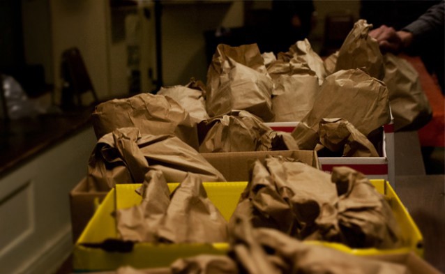 Volunteers at United Methodist Church in Baltimore spent much of Tuesday preparing and distributing food packages for residents. CREDIT: Dylan Petrohilos/ThinkProgress