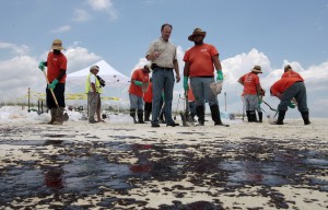 Oil cleanup workers in Gulf Shores, Ala., Friday, July 2, 2010. CREDIT: AP Photo/Dave Martin