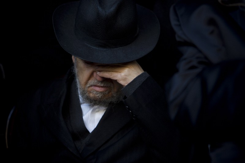 A man mourns at the funeral for a Jewish victim of the January attack on kosher grocery store in Paris, France, by a terrorist. The incident was a high-profile example of growing anti-Semitism in Europe and elsewhere. CREDIT: AP