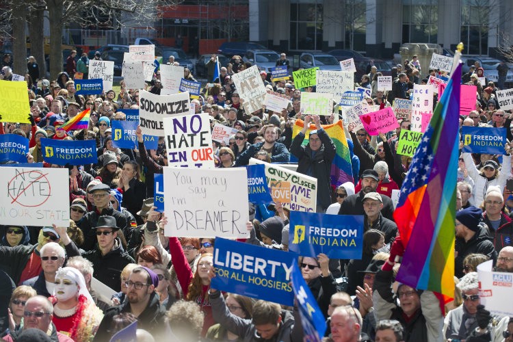 Protesters rallied against Indiana’s RFRA at the State House last Saturday. CREDIT: AP PHOTO/DOUG MCSCHOOLER