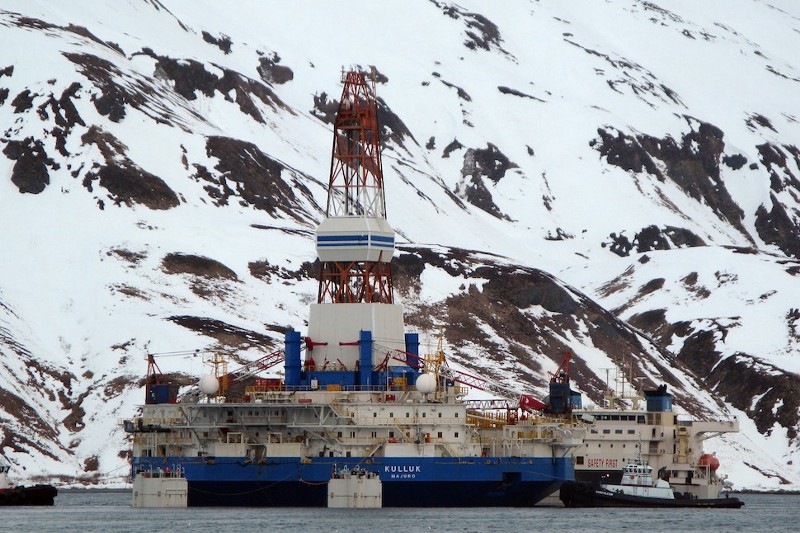 The damaged Royal Shell Dutch drilling barge Kulluk is loaded onto a transport ship in Unalaska, Alaska, on March 19, 2013. CREDIT: AP PHOTO / JIM PAULIN