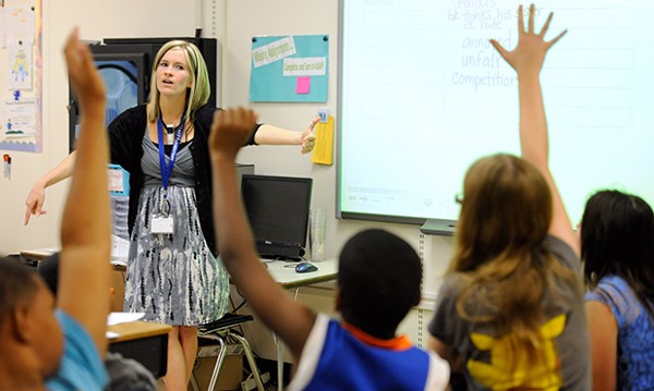 A teacher continues a lesson from her curriculum guided by the Common Core standards. CREDIT: AP Photo/Steve Ruark