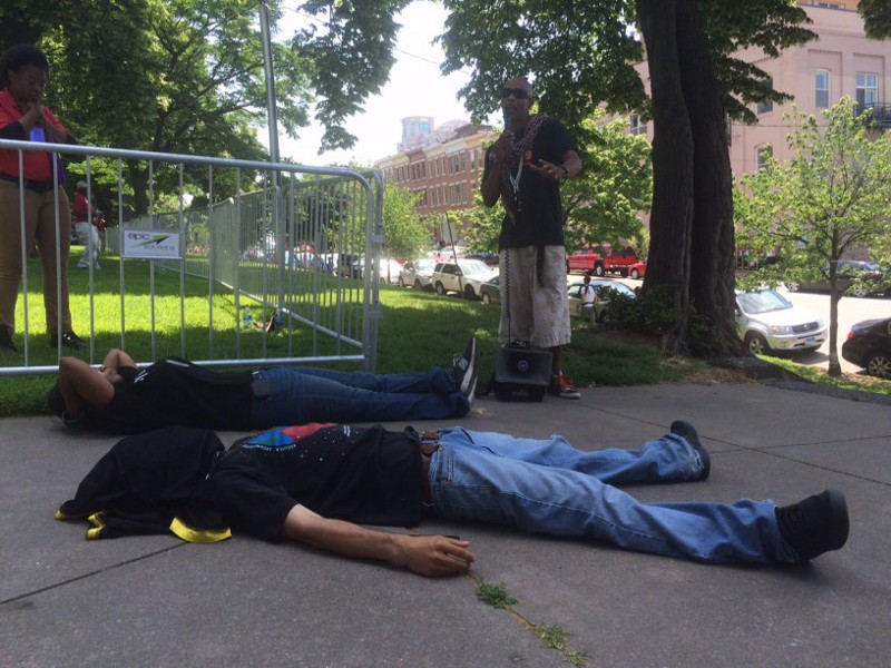 Activists stage a “die-in” in the park where O’Malley announced his campaign. CREDIT: Kira Lerner