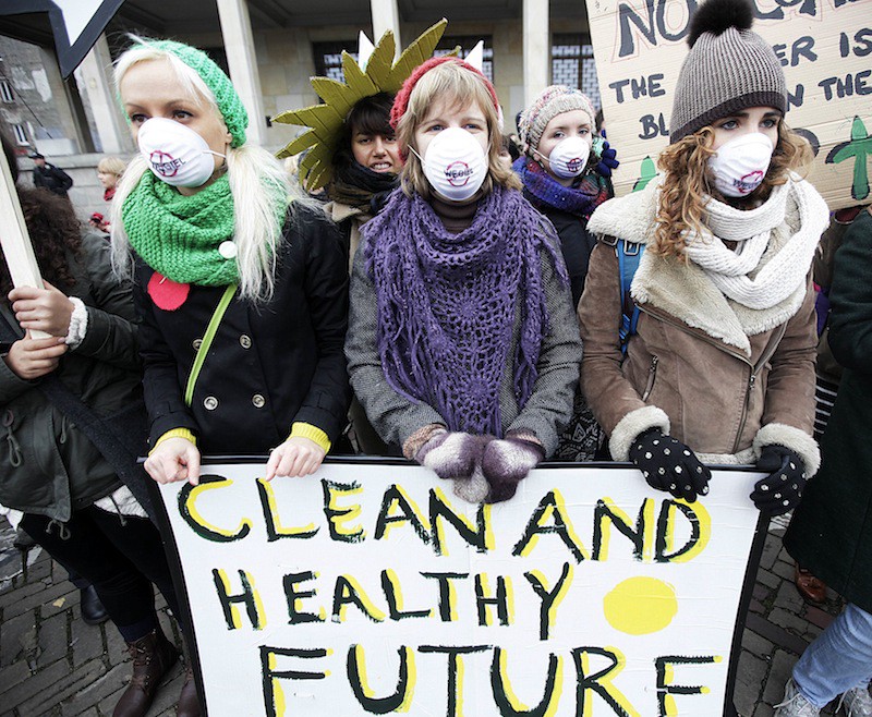 Protesters at the 2013 international climate negotiations in Warsaw. More than 100 CEOs and institutional investors are asking for a strong climate agreement at the 2015 Paris talks. CREDIT: AP PHOTO/CZAREK SOKOLOWSKI