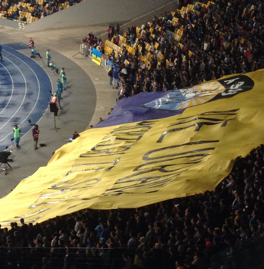 Dnipro fans unfurling a banner in support of a right-wing paramilitary group CREDIT: Scott Keyes