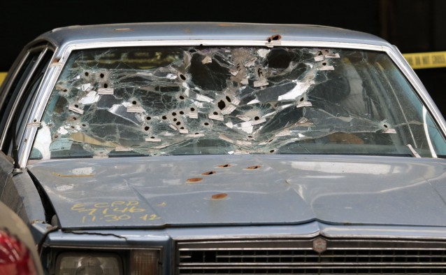 The car driven by Timothy Russell after it was pummeled with 137 bullets. CREDIT: AP