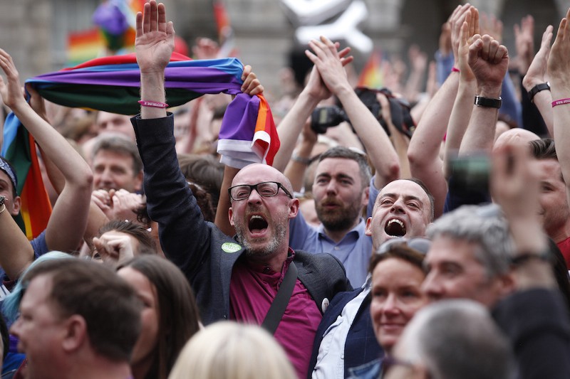 Marriage equality supporters celebrate after learning the final result of the nation’s referendum on same-sex marriage this weekend outside of Dublin castle, Ireland. CREDIT: AP