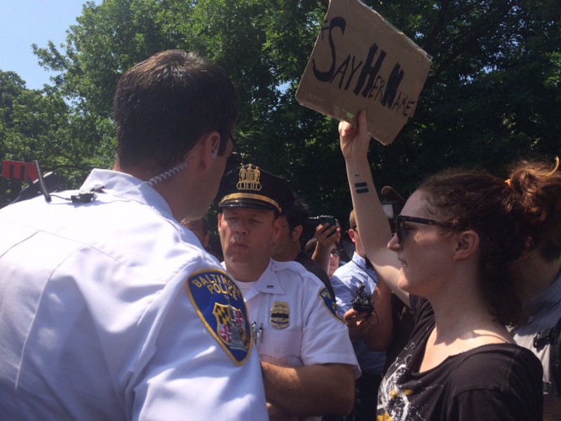 Activist Megan Kenny is approached by police. CREDIT: Kira Lerner