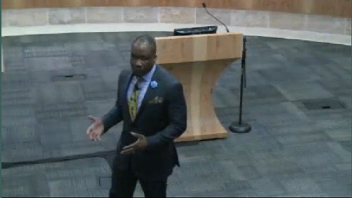 A speaker explaining how to relate to women in leadership positions. CREDIT: ATXN