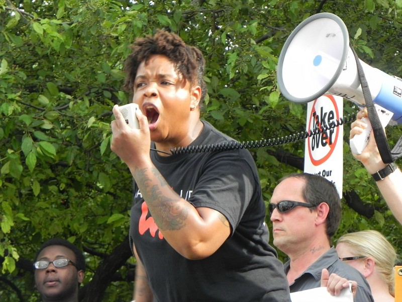 Milwaukee Public School parent Angela Walker rallies the community against a proposed takeover. CREDIT: ALICE OLLSTEIN