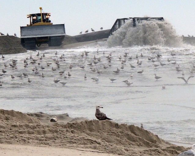 A mixture of sand and water is pumped ashore May 2015 in coastal NJ as part of a beach replenishment project. CREDIT: AP PHOTO/WAYNE PARRY