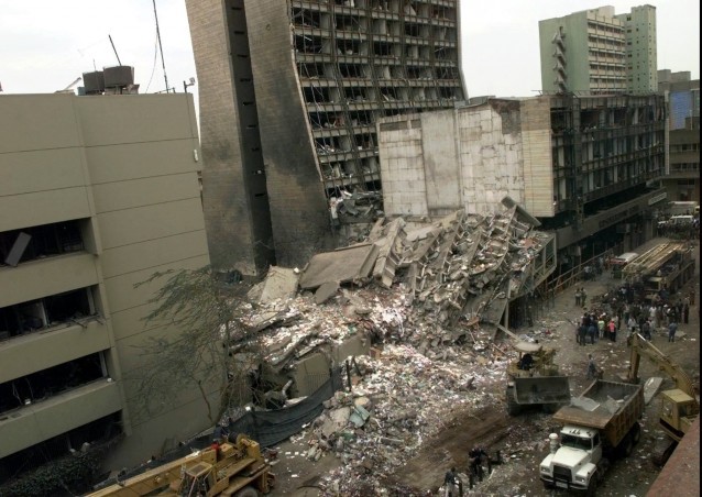 The United States Embassy, left, and other damaged buildings in downtown Nairobi, Kenya, are shown on the day after it was bombed by terrorists. CREDIT: AP