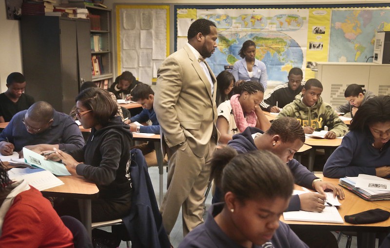 Adofo Muhammad, center, principal of Bedford Academy High School, teaches 10th and 11th graders in his Global Studies class on Tuesday, Dec. 3, 2013 in New York. CREDIT: AP/BEBETO MATTHEWS