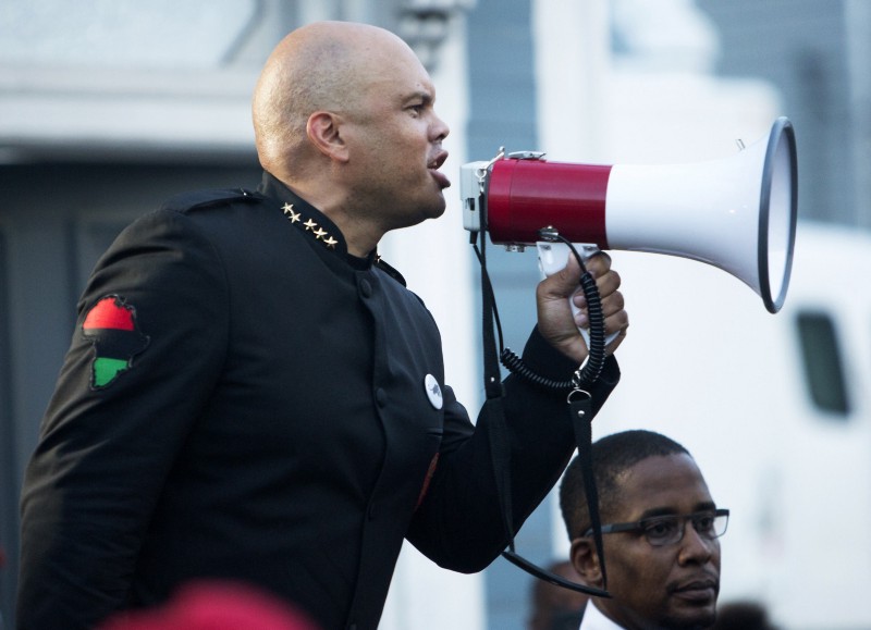 Hashim Nzinga, left, a marcher who identified himself as national chairman of the New Black Panther party, gives a speech in front of Emanuel AME Church in Charleston, S.C., Tuesday, June 23, 2015. CREDIT: AP PHOTO/MIC SMITH