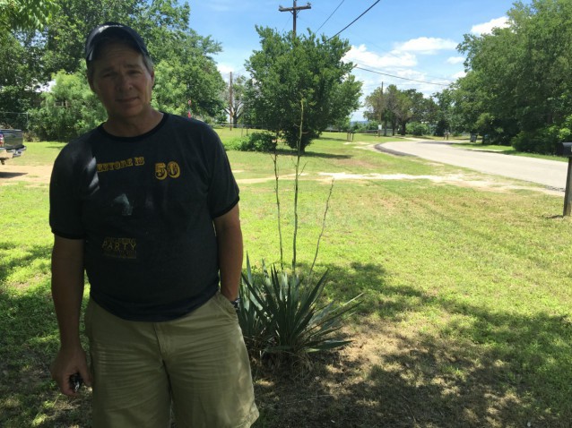 Scot Bryn stands in front of his house in Spicewood Beach, Texas. Before deciding to move to the area he made sure he felt that the water supply was secure. CREDIT: ThinkProgress/ Ari Phillips