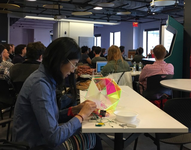 A young woman crafts a light fixture during one of FACETS sessions. CREDIT: Lauren C. Williams