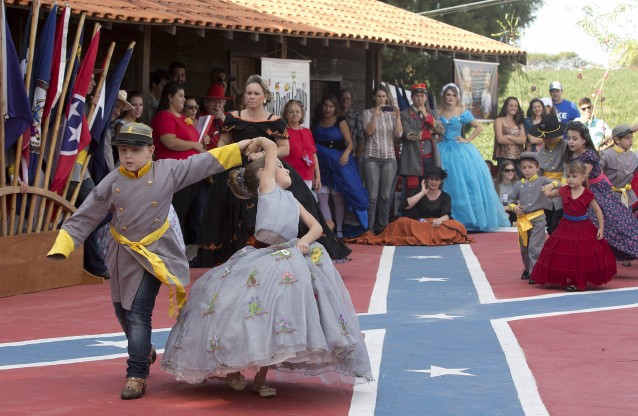 Pairs, young and old, solemnly presented the flags of the 13 Confederate states and square danced to raucous fiddle music. CREDIT: AP