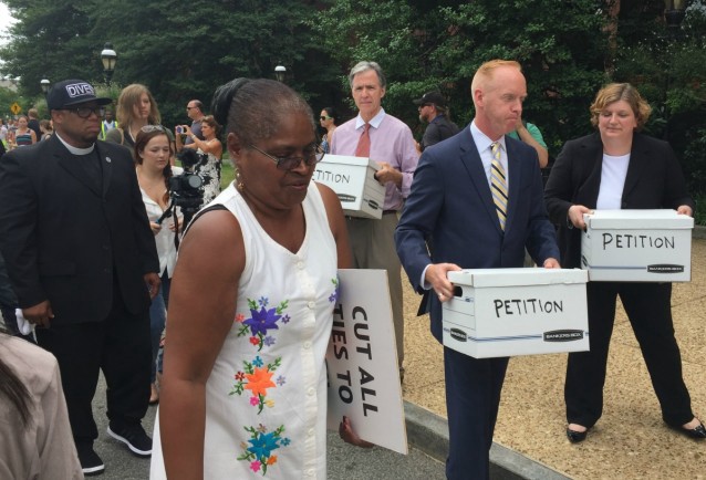 Protesters deliver signatures to Smithsonian staff. CREDIT: Natasha Geiling