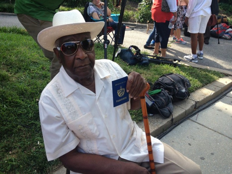 Cuban-American Eloy Hernandez shows off his Cuban passport as he celebrates the opening of the embassy. CREDIT: Alice Ollstein