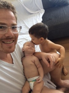 Bud Lake holds his daughter Carmen as his son, Álvaro plants a kiss on her head. CREDIT: #bringcarmenhome