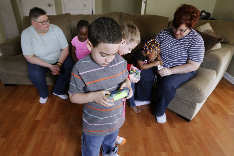Michigan plaintiffs Jayne Rowse, April DeBoer, and their adopted children Ryanne, Nolan, Jacob, and Rylee. CREDIT: AP PHOTO/PAUL SANCYA