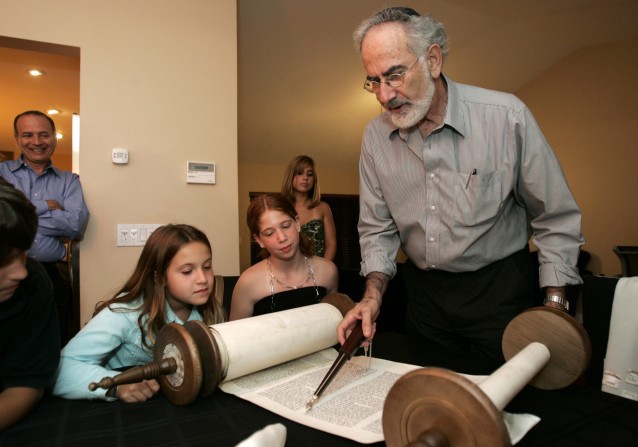Members of a Reform synagogue in Miami read from a Torah. CREDIT: AP Photo/Lynne Sladky