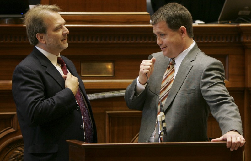 In this Thursday, May 21, 2009 file photo, Sen. Lee Bright, R-Spartanburg, right, holds onto the microphone as Sen. Brad Hutto, D-Orangeburg, objects to the disruptions during the last day of the legislative session as they were dealing with the governors budget vetoes at the Statehouse in Columbia, S.C. Bright thinks America is at a vital crossroads and must make the right decisions to survive. The Spartanburg County lawmaker’s political career seems to be at a similar juncture, as he decides whether to cash in on his conservative credentials and take on U.S. Sen. Lindsey Graham in the 2014 Republican primary. CREDIT: AP PHOTO/MARY ANN CHASTAIN