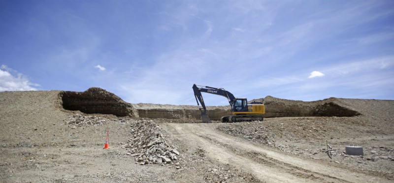 This July 13, 2015, photo, shows construction at the U.S. Oil Sands commercial tar sands operation, in the Book Cliffs, in eastern Utah. Utah state officials have given the go-ahead for the mine under construction the eastern flank of the state, but they will require the company to do water and air quality monitoring in a move environmentalists are calling a victory. CREDIT: AP PHOTO/RICK BOWMER