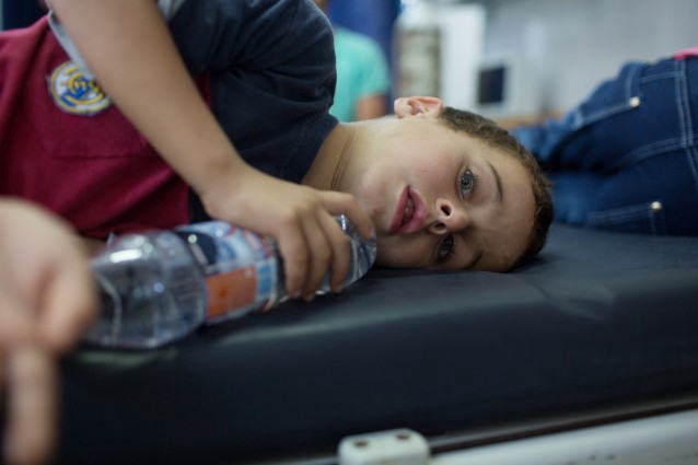 A young Syrian boy who was rescued after a boat carrying his family and hundreds of other migrants capsized, recovers at a hospital in Zuwara, Libya. CREDIT: AP Photo/Mohamed Ben Khalifa