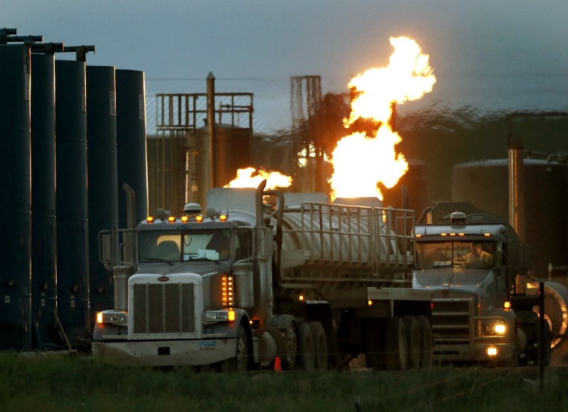 A natural gas burn near Williston, N.D. Burning off natural gas is significantly cleaner than letting the methane leak. CREDIT: AP PHOTO/CHARLES REX ARBOGAST