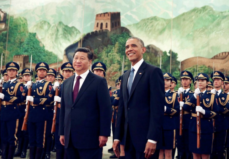 In Beijing, President Barack Obama smiles next to China’s President Xi Jinping during a welcome ceremony in 2014. CREDIT: AP PHOTO/ANDY WONG
