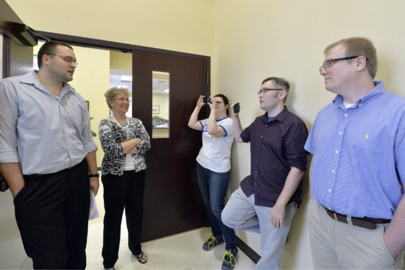 David Ermold and David Moore, right, sought a marriage license Thursday morning, but were refused by Rowan County clerks Nathan Davis and Roberta Earley, left. CREDIT: AP PHOTO/TIMOTHY D. EASLEY
