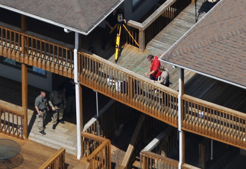 Investigators at the scene of the shooting of two WDBJ-TV employees CREDIT: AP PHOTO/STEVE HELBER