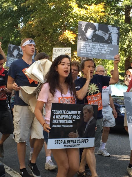 Protesters march from Volta Park to Secretary Kerry’s home Tuesday. CREDIT: Natasha Geiling