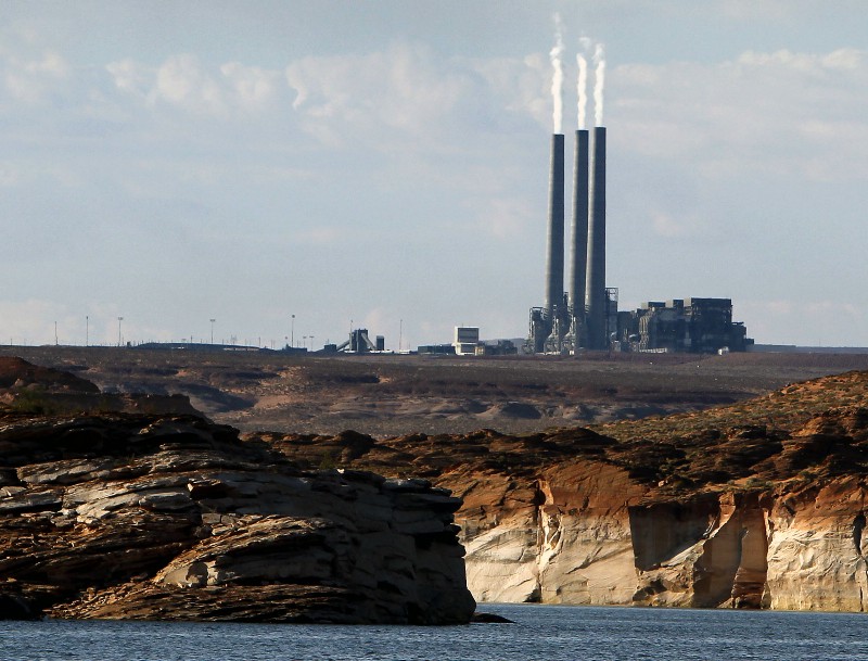 The main plant facility at the Navajo Generating Station, as seen from Lake Powell in Page, Arizona. CREDIT: AP PHOTO/ROSS D. FRANKLIN, FILE