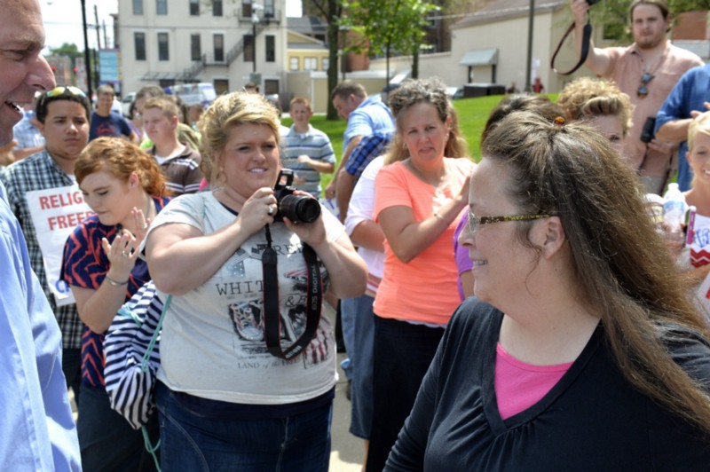 Rowan County Clerk Kim Davis greeting supporters outside the federal courthouse in July. CREDIT: AP PHOTO/TIMOTHY D. EASLEY