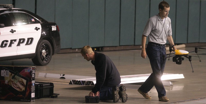 Preparations for a 2014 drone demonstration with the Grand Forks, North Dakota, Police Department CREDIT: AP PHOTO/BRUCE CRUMMY