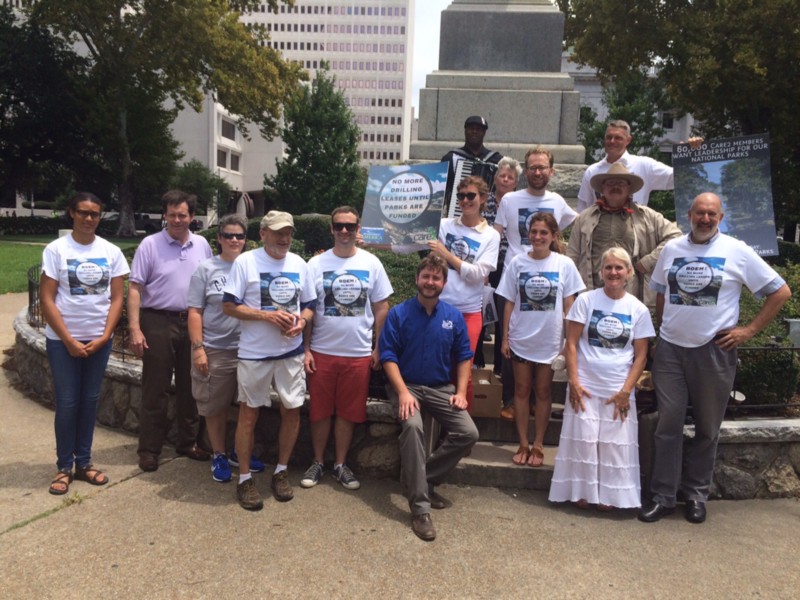 Protesters, including a Teddy Roosevelt impersonator, pose in New Orleans. CREDIT: ENVIRONMENT AMERICA