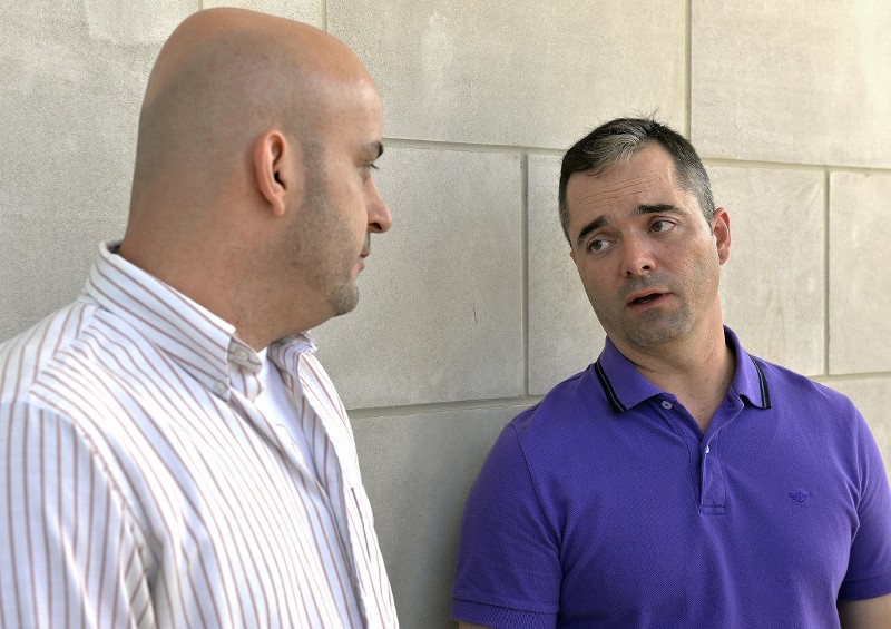 William Smith Jr., left, and his partner James Yates. CREDIT: AP PHOTO/TIMOTHY D. EASLEY