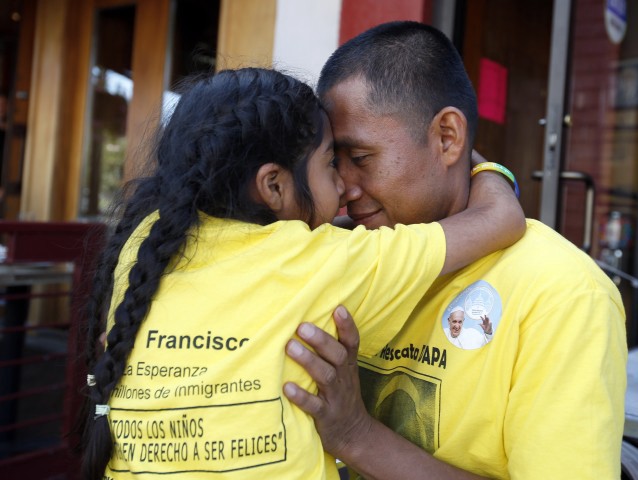 Sophie Cruz, 5, from suburban Los Angeles, hugs her father Raul Cruz during an interview with the Associated Press. CREDIT: AP Photo/Alex Brandon