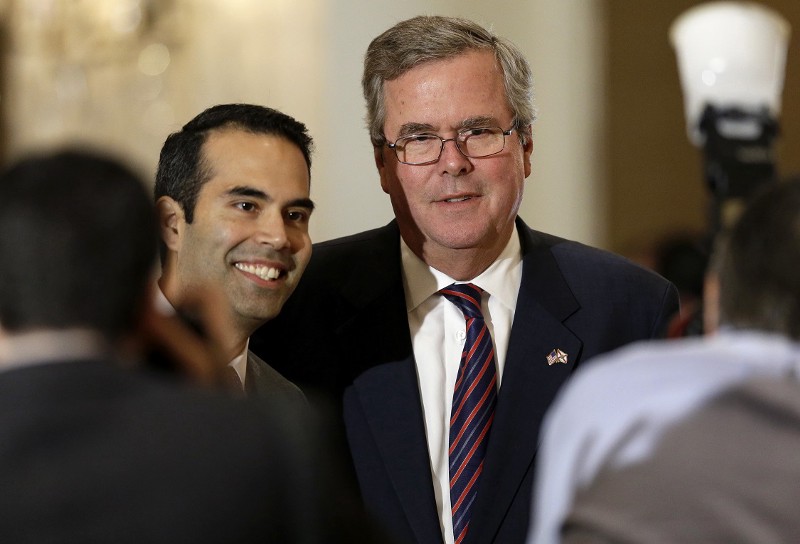 Presidential candidate Jeb Bush with his son, George P. Bush, a Spanish-speaking attorney who has been hailed the future of the Republican party. CREDIT: AP PHOTO/TONY GUTIERREZ