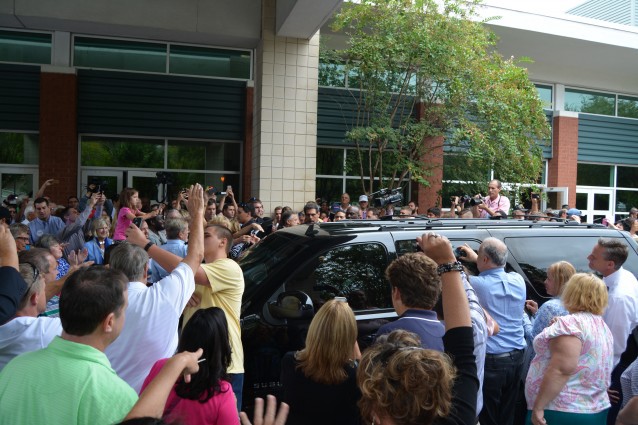 Supporters surround Trump’s car as he leaves Charleston. CREDIT: Kira Lerner