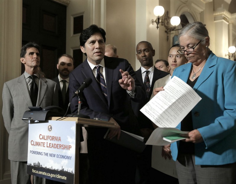 State Senate President Pro Tem Kevin de Leon, D-Los Angeles, center, answers a question concerning a pair of environmental measures before the Legislature, during a news conference,Tuesday, Aug. 25, 2015, in Sacramento, Calif. CREDIT: AP PHOTO/RICH PEDRONCELLI