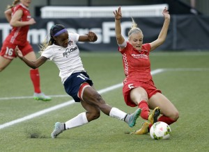 Crystal Dunn (left) CREDIT: AP Photo/Don Ryan