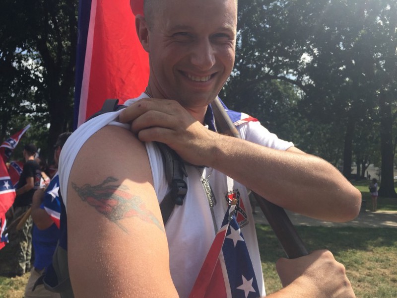 Confederate flag supporter Jason Berry shows off his tattoo. CREDIT: Emily Atkin