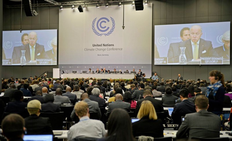 French foreign minister Laurent Fabius talks to delegates during the United Nations Framework Convention on Climate Change in Bonn, Germany, Monday, June 1, 2015. CREDIT: AP PHOTO/MARTIN MEISSNER