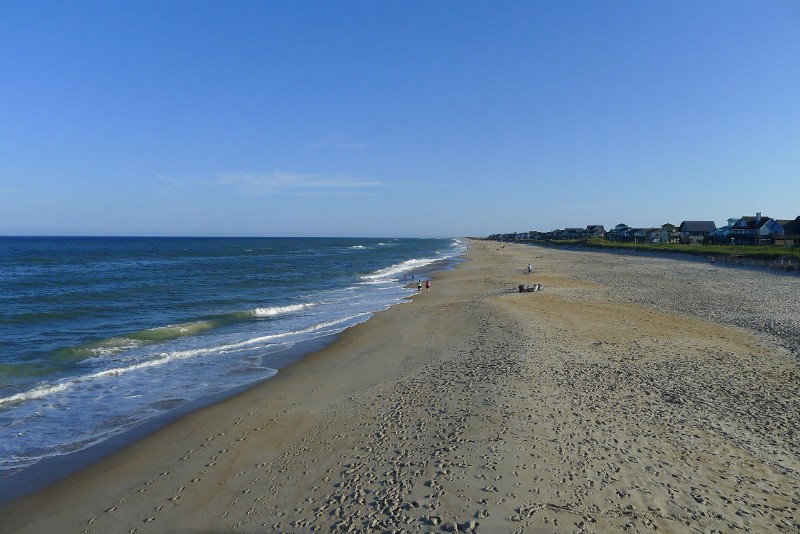 Beachgoers in Avon, North Carolina. Many businesses along the Atlantic Coast worry that opening up the ocean to drilling would be bad for the tourism business. CREDIT: AP PHOTO/TAMARA LUSH