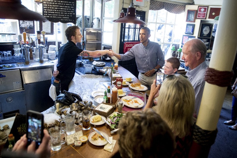 President Obama meets restaurant employees ahead of issuing an executive order on paid sick leave CREDIT: AP PHOTO/ANDREW HARNIK
