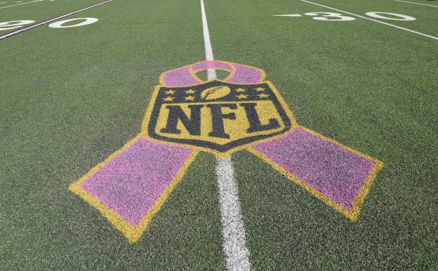 A pink ribbon representing breast cancer awareness is emblazoned on the field before an NFL football game between the Baltimore Ravens and the Cleveland Browns CREDIT: AP Photo/Nick Wass